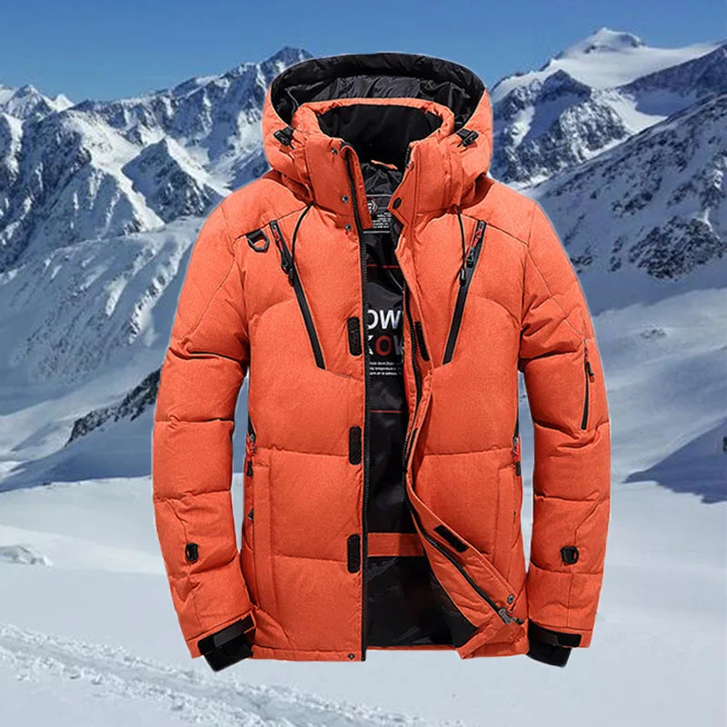 Winter men's casual high quality warm orange jacket with hood against snowy mountain background