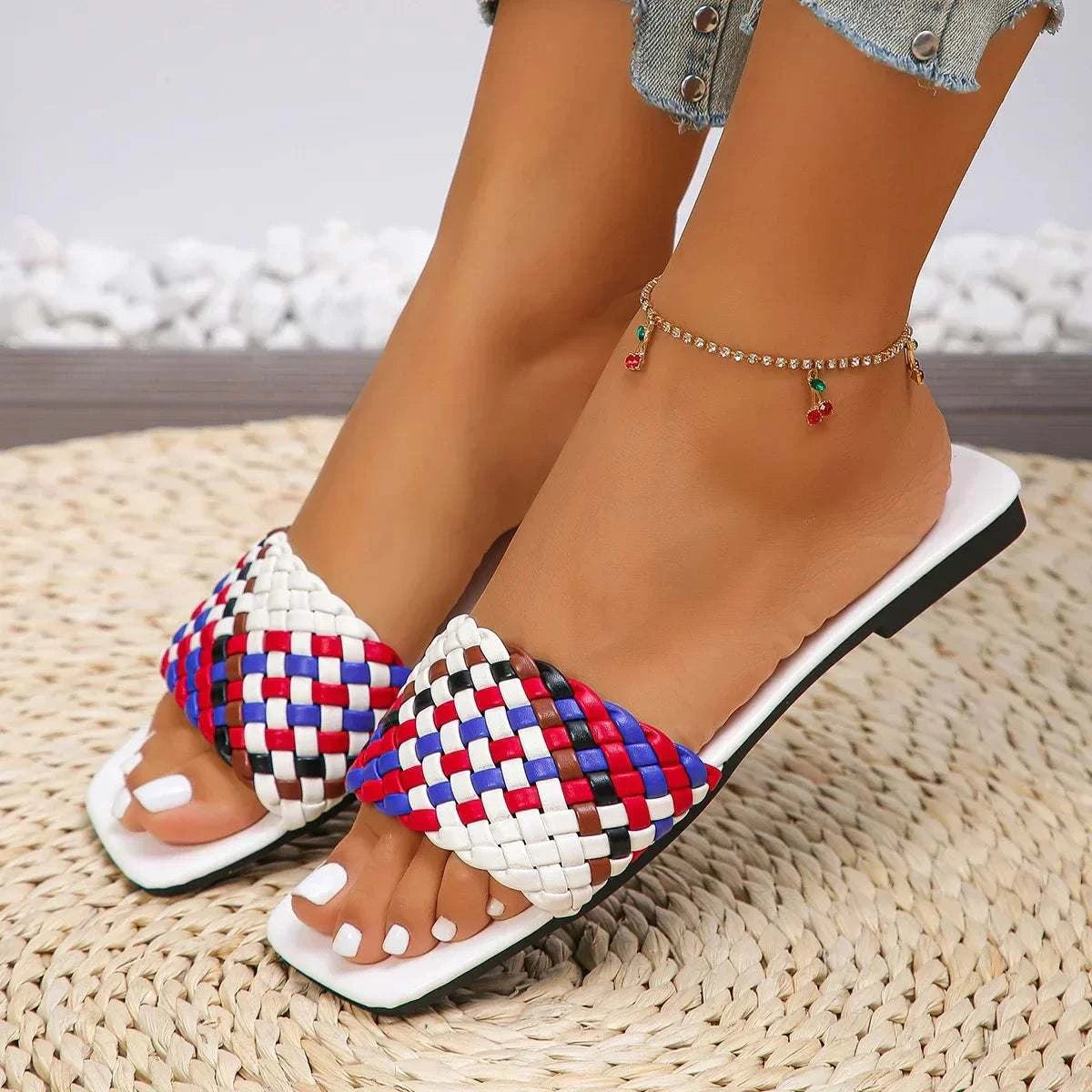 womens summer slippers with colorful woven straps and white sole on foot