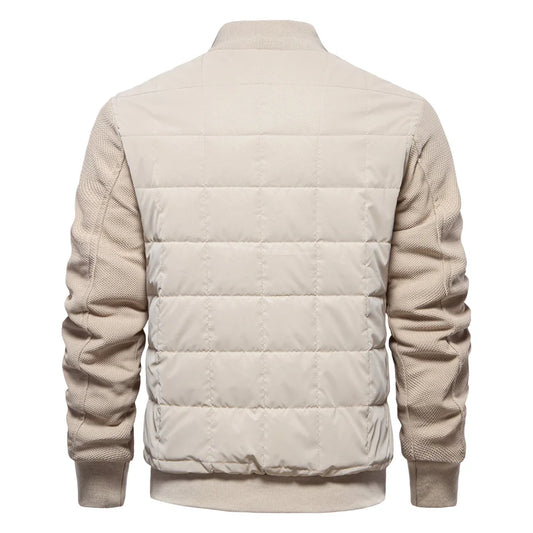 Back view of men's winter warm stand collar jacket in beige with quilted polyester body and knitted sleeves