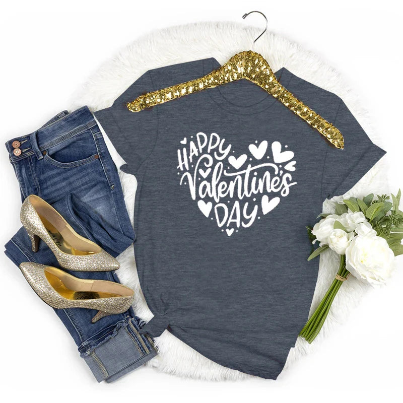 Women's Happy Valentine's Day short sleeve t-shirt with heart design styled with jeans, gold heels, and white flowers