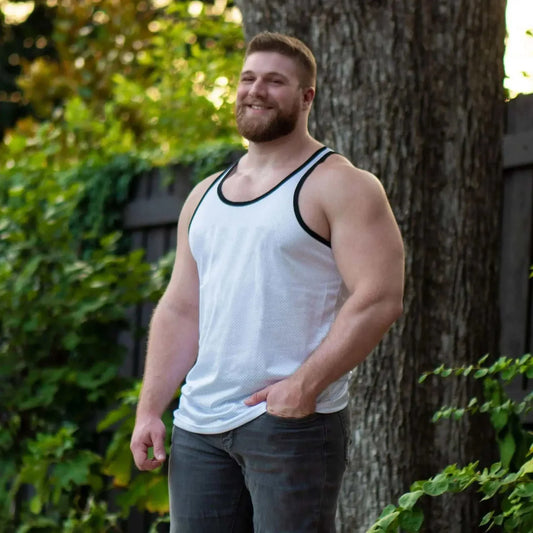 muscular man wearing white men's summer fitness tank top outdoors gym tank tops men