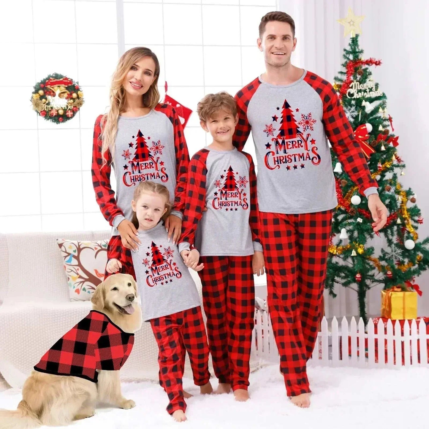 Family wearing matching Christmas pajamas celebrating festive holiday night