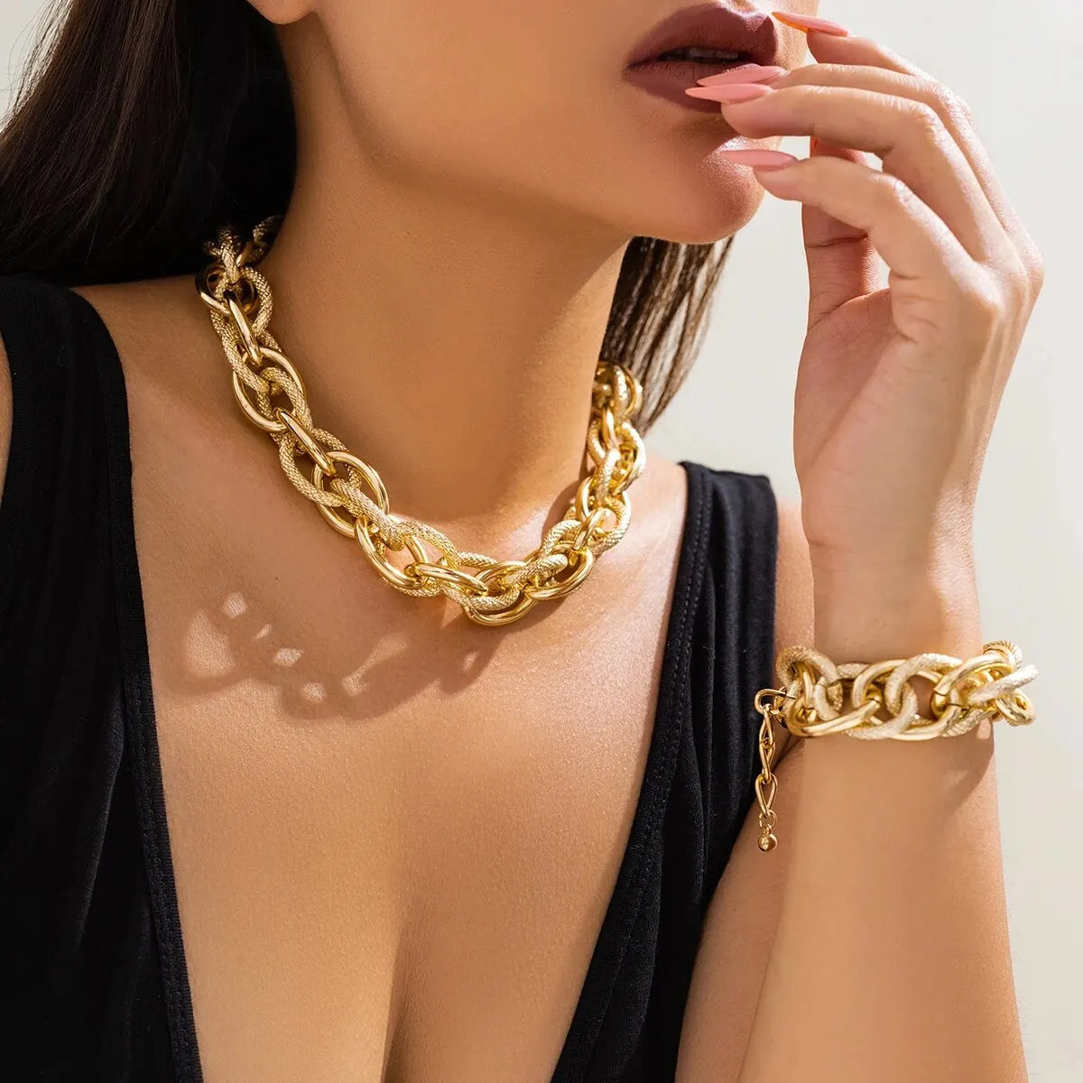 woman wearing gold chain choker necklace jewelry set with matching bracelet