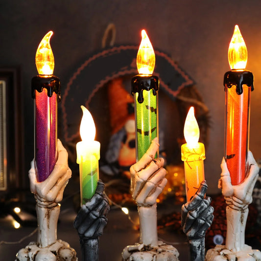 Glowing Halloween candle lights held by skeletal hands in festive colors