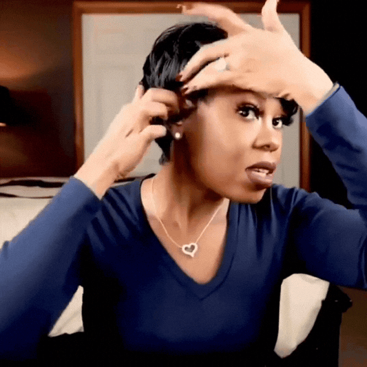 Woman wearing a natural black women's short pixie cut bob wig