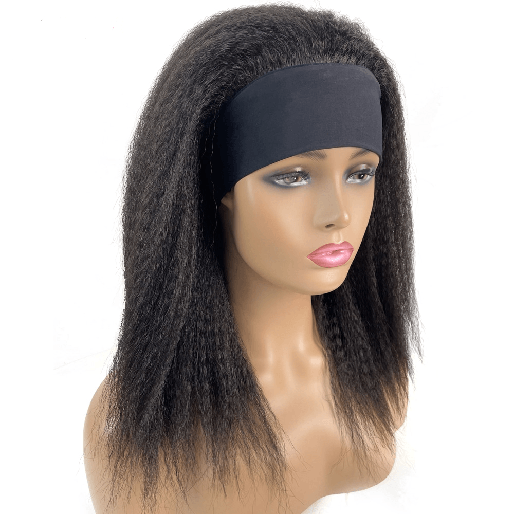 Women's natural black afro wig with textured voluminous hair and black headband on mannequin