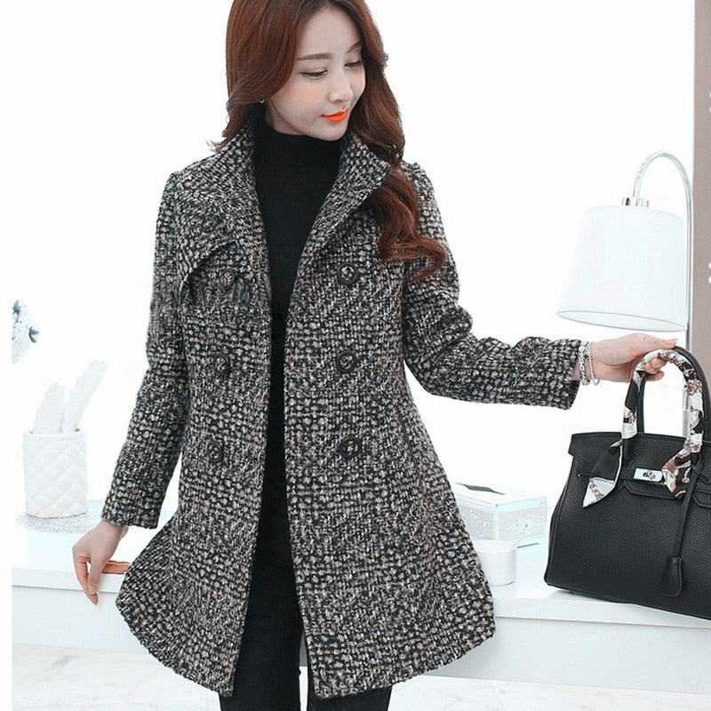 Woman wearing stylish women's wool blends winter coat with black and white tweed pattern indoors
