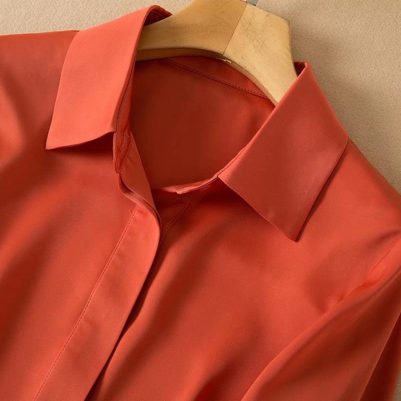 High quality casual elegant vintage women's shirt set in orange with long sleeves and collar on wooden hanger