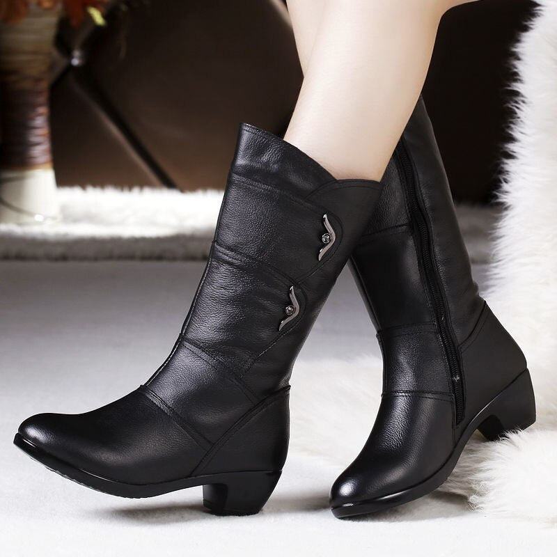 Black women's winter boots with mid-calf height and decorative side buckle detail