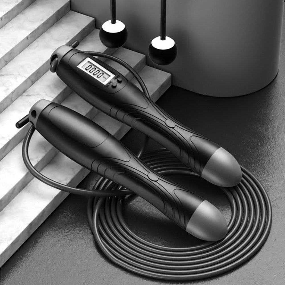 Black cordless electronic skipping rope with digital LCD screen on handle showing jump count