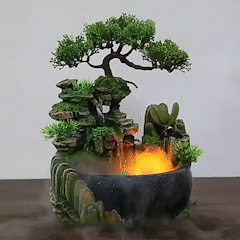 Water fountain air spray with green plant home decoration and glowing water feature