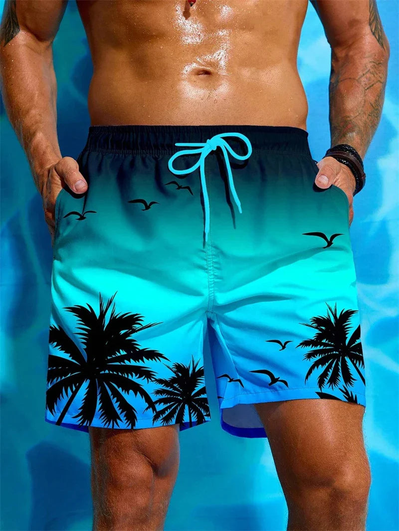 Men's summer swim trunks with palm tree and bird print in blue gradient design