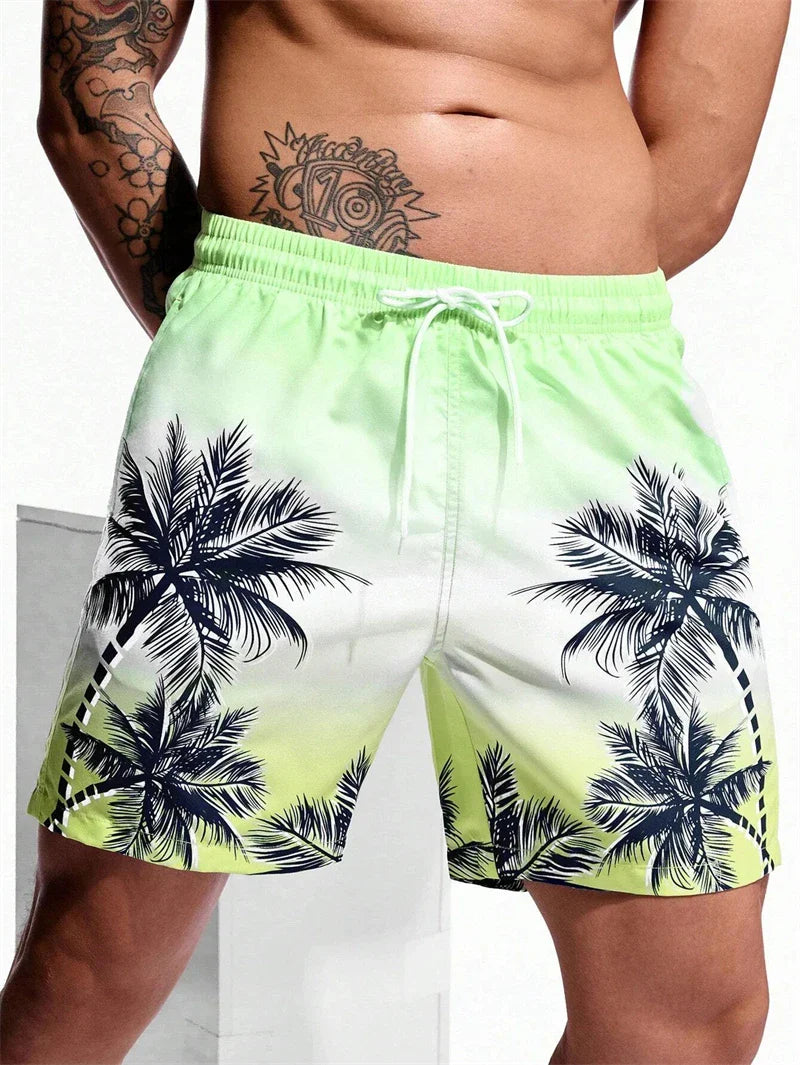 Men's summer swim trunks with green gradient and black palm tree print