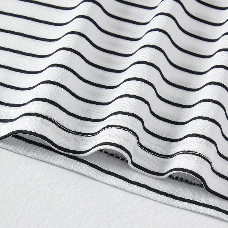 Close-up of white and black striped fabric from children's 3 pieces set summer tank top