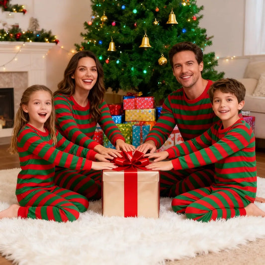 Family wearing cozy matching family Christmas pajamas celebrating holiday together
