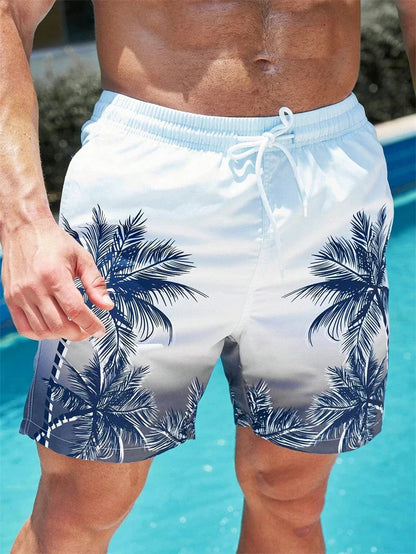 Men's summer swim trunks with palm tree design by pool