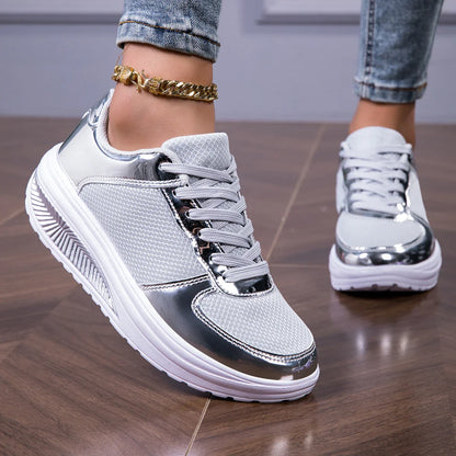 Women's walking shoes in silver with white soles and mesh upper, styled with ankle bracelet