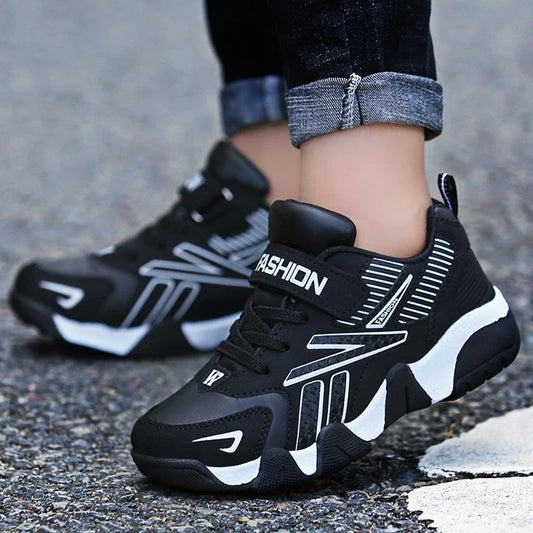 Black kids outdoor running shoes sneakers with white accents and Velcro strap